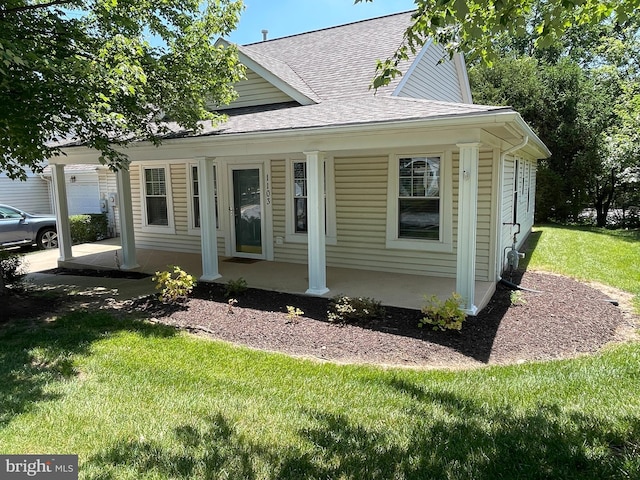 1103 Jousting Way, Mount Airy, MD 21771 - view of front facade with covered porch, roof with shingles, and a front lawn