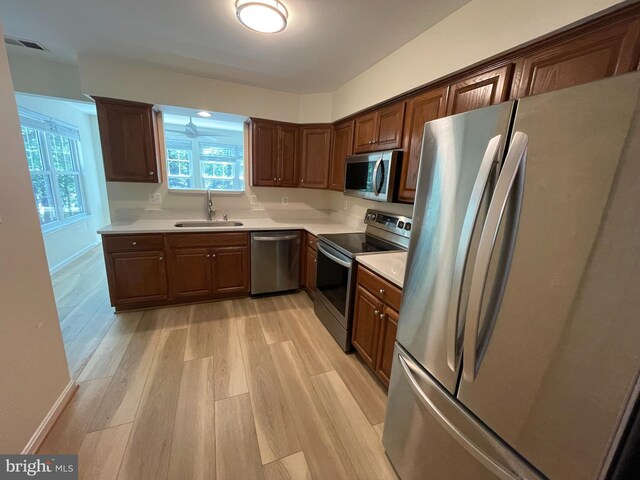 1103 Jousting Way, Mount Airy, MD 21771 - kitchen featuring stainless steel appliances, light wood finished floors, and light countertops