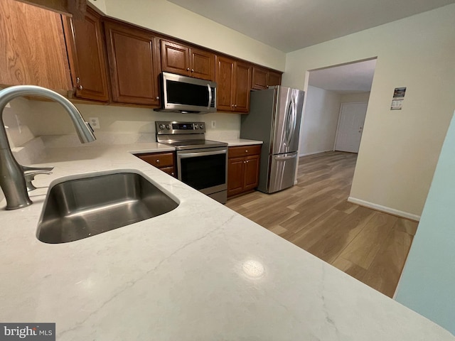 1103 Jousting Way, Mount Airy, MD 21771 - kitchen with appliances with stainless steel finishes and light wood-type flooring