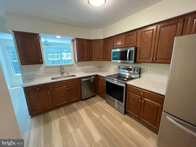 1103 Jousting Way, Mount Airy, MD 21771 - kitchen with stainless steel appliances, light wood-style flooring, and light countertops