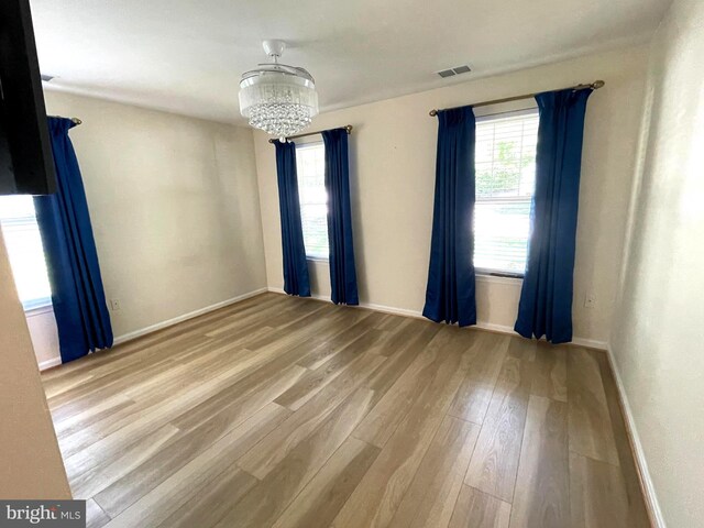 1103 Jousting Way, Mount Airy, MD 21771 - spare room featuring a chandelier and light wood-style floors