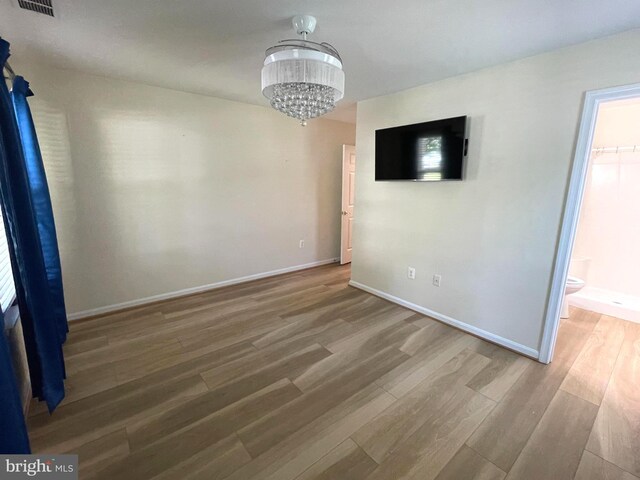 1103 Jousting Way, Mount Airy, MD 21771 - unfurnished dining area featuring wood finished floors and a chandelier