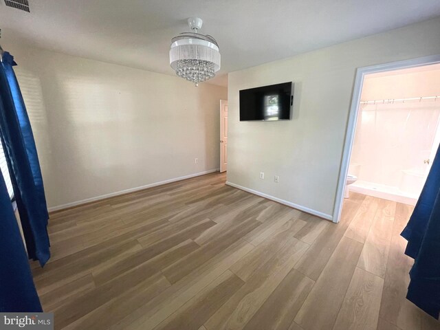1103 Jousting Way, Mount Airy, MD 21771 - unfurnished dining area featuring wood finished floors and a chandelier