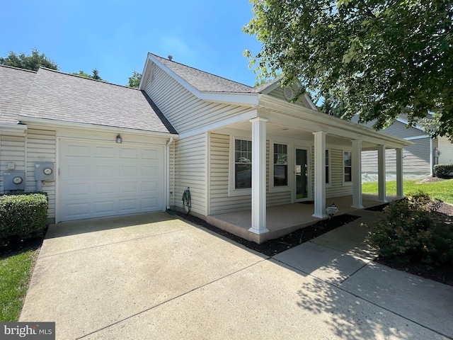 1103 Jousting Way, Mount Airy, MD 21771 - view of property exterior featuring covered porch, driveway, a garage, and a shingled roof