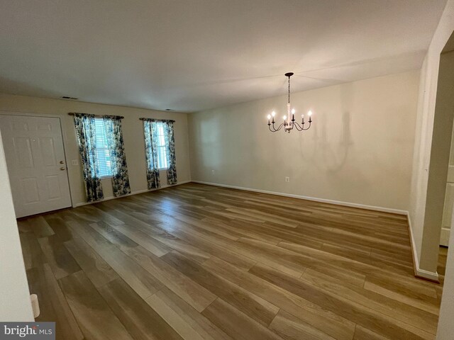 1103 Jousting Way, Mount Airy, MD 21771 - unfurnished dining area featuring a chandelier and wood finished floors