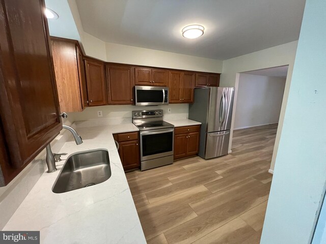 1103 Jousting Way, Mount Airy, MD 21771 - kitchen featuring appliances with stainless steel finishes, light countertops, and light wood-style floors