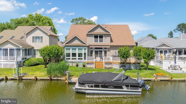 7 Widows Watch Ct, Ocean Pines, MD 21811 - rear view of house featuring a sunroom, a deck with water view, boat lift, and a yard