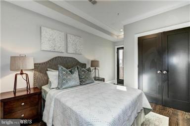 3624 10th St NW Unit 4, Washington, DC 20010 - bedroom with dark wood-style floors and a closet