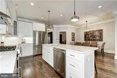 3624 10th St NW Unit 4, Washington, DC 20010 - kitchen with appliances with stainless steel finishes, dark wood-type flooring, light countertops, recessed lighting, and white cabinetry