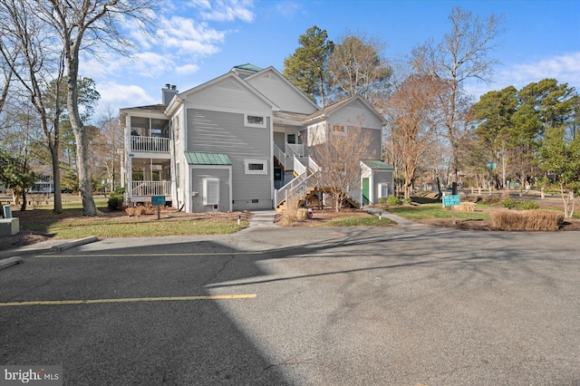 39334 Tall Pines Ct Unit 15001, Bethany Beach, DE 19930 - view of front of home with stairs, a chimney, and crawl space