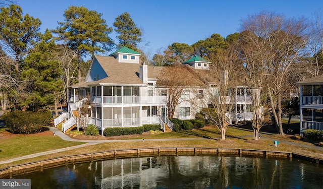 39334 Tall Pines Ct Unit 15001, Bethany Beach, DE 19930 - back of house featuring a sunroom, stairway, a water view, and a shingled roof