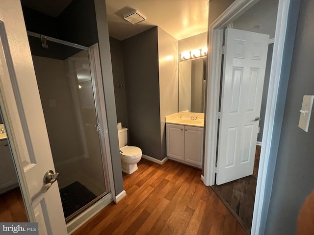 11002 Koman Cir Unit 202, Manassas, VA 20109 - full bath with vanity, a shower stall, and wood finished floors