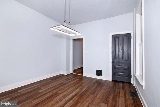 14 S 11th St, Lebanon, PA 17042 - unfurnished dining area with dark wood-type flooring and baseboards