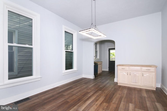 14 S 11th St, Lebanon, PA 17042 - unfurnished dining area featuring dark wood-style floors and arched walkways