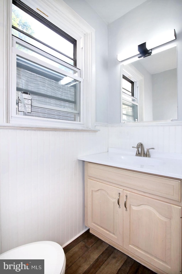 14 S 11th St, Lebanon, PA 17042 - half bathroom with vanity, wood finished floors, and wainscoting