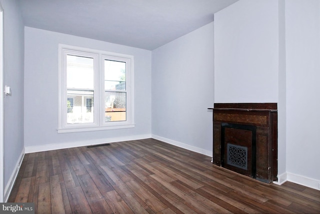 14 S 11th St, Lebanon, PA 17042 - unfurnished living room featuring dark wood-style floors and a fireplace