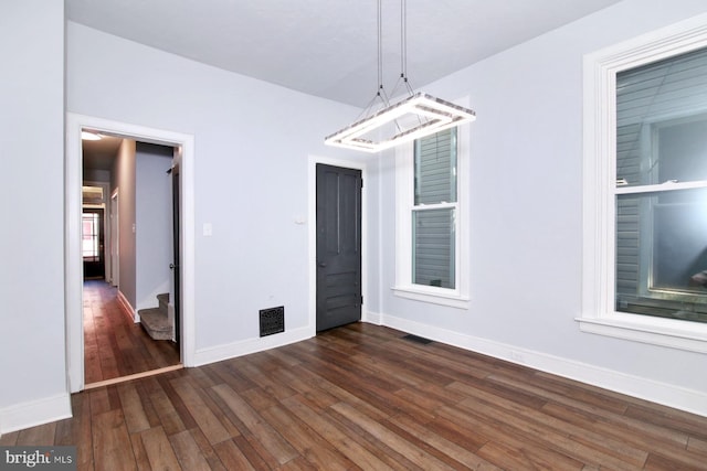 14 S 11th St, Lebanon, PA 17042 - unfurnished dining area featuring dark wood-style floors and baseboards