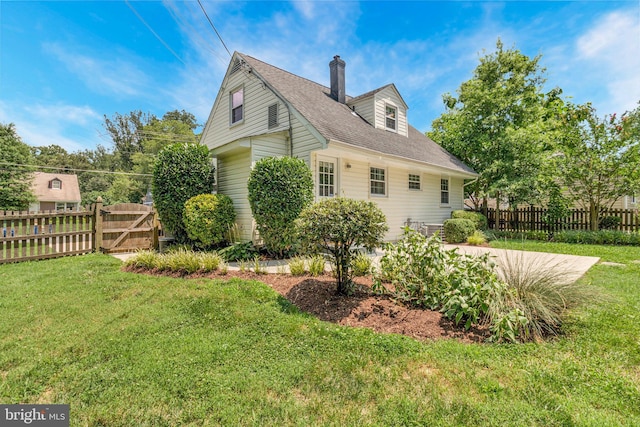 6910 Quander Rd, Alexandria, VA 22307 - view of side of home with a chimney and a shingled roof
