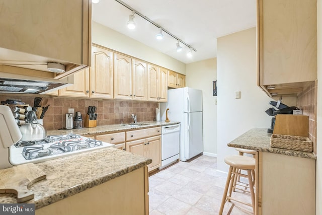 501 N Bethlehem Pike Unit 14-Q, Ambler, PA 19002 - kitchen with light brown cabinetry, white appliances, tasteful backsplash, and light stone countertops
