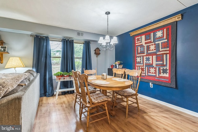501 N Bethlehem Pike Unit 14-Q, Ambler, PA 19002 - dining room with a chandelier and light wood-style flooring