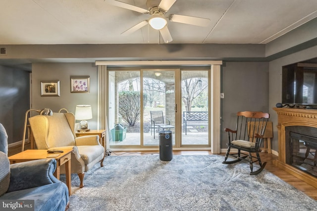 501 N Bethlehem Pike Unit 14-Q, Ambler, PA 19002 - living area with a glass covered fireplace, a ceiling fan, and wood finished floors