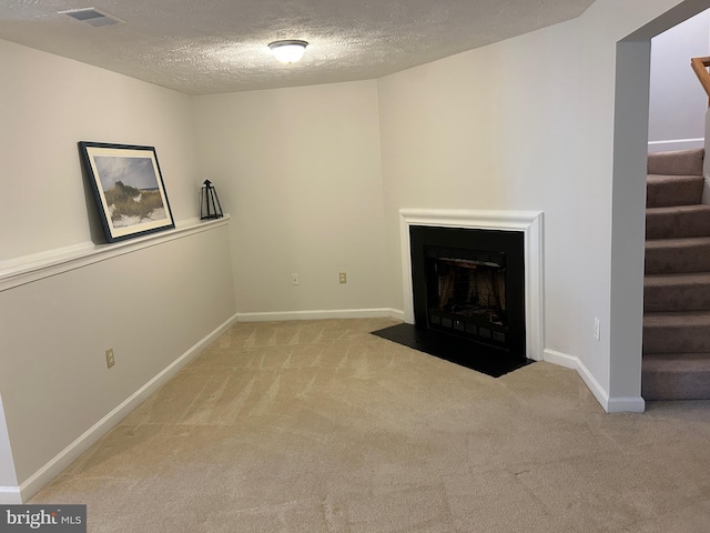15496 Travailer Ct, Woodbridge, VA 22193 - unfurnished living room with carpet, stairway, a textured ceiling, and a fireplace with flush hearth