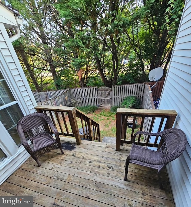 15496 Travailer Ct, Woodbridge, VA 22193 - wooden deck featuring a fenced backyard and a gate