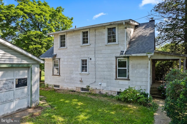 431 E Summit Ave, Telford, PA 18969 - rear view of property featuring a shingled roof, a chimney, and a lawn