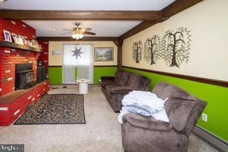 3782 Grandview Ave, Bensalem, PA 19020 - living area featuring beam ceiling, carpet, ceiling fan, and a fireplace