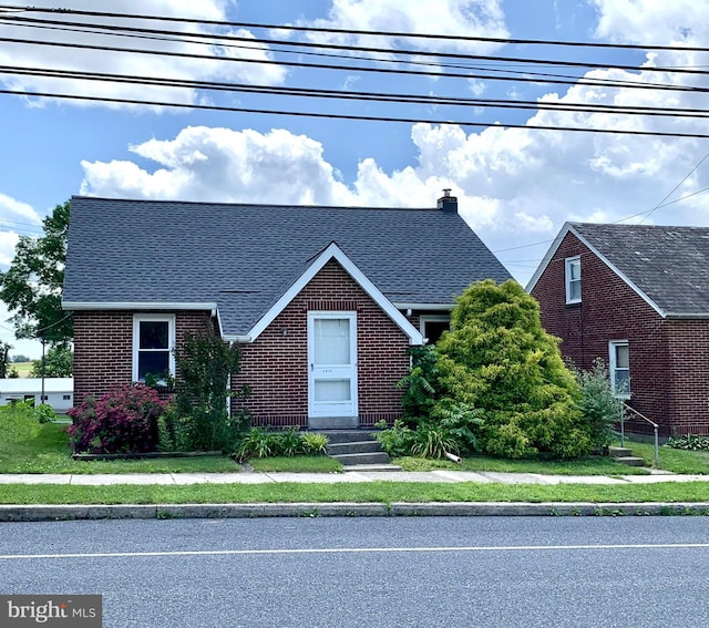 3019 Old Rte 22, Hamburg, PA 19526 - english style home with brick siding, a shingled roof, and a chimney