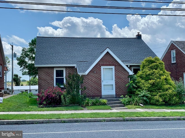 3019 Old Rte 22, Hamburg, PA 19526 - tudor home featuring brick siding, roof with shingles, and a chimney
