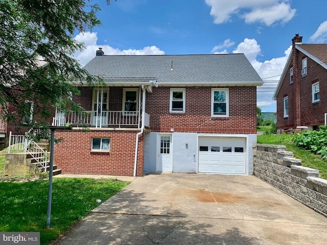 3019 Old Rte 22, Hamburg, PA 19526 - rear view of house with brick siding, concrete driveway, a garage, and stairway