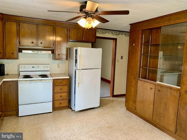 3019 Old Rte 22, Hamburg, PA 19526 - kitchen featuring white appliances, under cabinet range hood, a ceiling fan, light countertops, and brown cabinets
