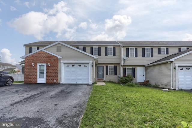 206 Lighthouse Dr, Jonestown, PA 17038 - view of property with a garage, a front yard, brick siding, and driveway