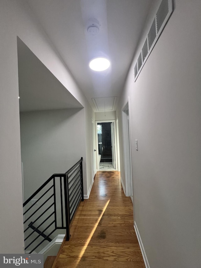 63 Baker Blvd, Marlton, NJ 08053 - corridor featuring attic access, wood finished floors, and an upstairs landing