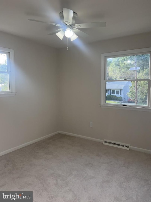 63 Baker Blvd, Marlton, NJ 08053 - carpeted empty room featuring plenty of natural light and a ceiling fan