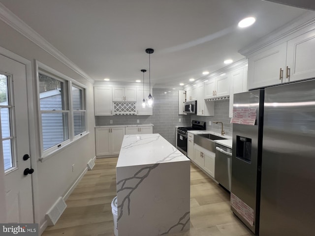 63 Baker Blvd, Marlton, NJ 08053 - kitchen with appliances with stainless steel finishes, decorative backsplash, white cabinetry, ornamental molding, and recessed lighting