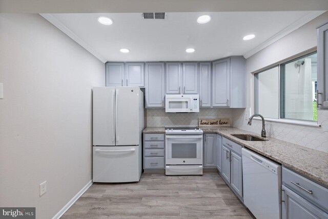 3533 Fitzhugh Ln Unit 77-A, Silver Spring, MD 20906 - kitchen with white appliances, gray cabinetry, backsplash, light stone countertops, and ornamental molding