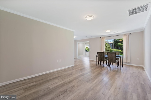 3533 Fitzhugh Ln Unit 77-A, Silver Spring, MD 20906 - dining area with crown molding and light wood-style flooring