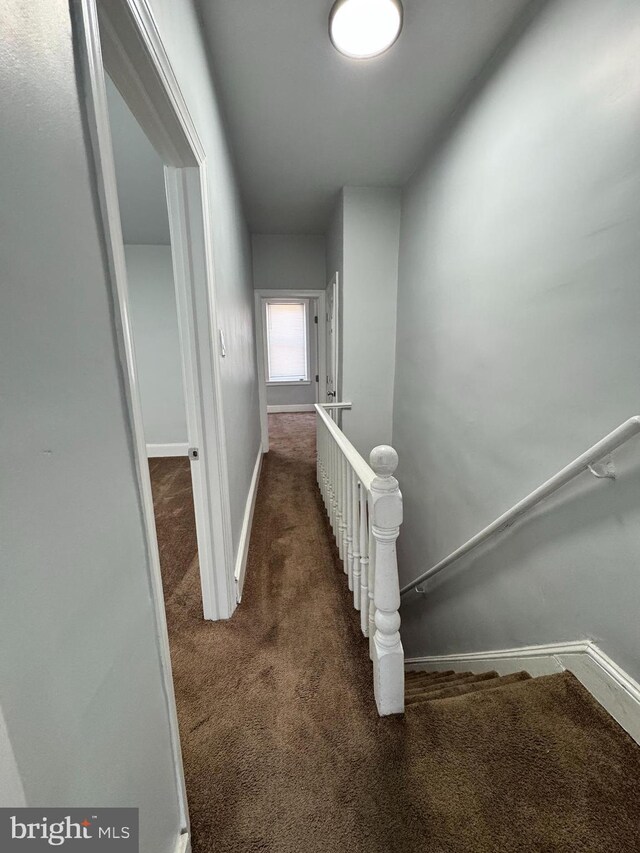 3103 N Croskey St, Philadelphia, PA 19132 - corridor featuring dark colored carpet and an upstairs landing