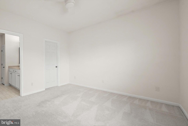 34704 Villa Cir Unit 1307, Lewes, DE 19958 - unfurnished bedroom featuring light colored carpet and ensuite bath