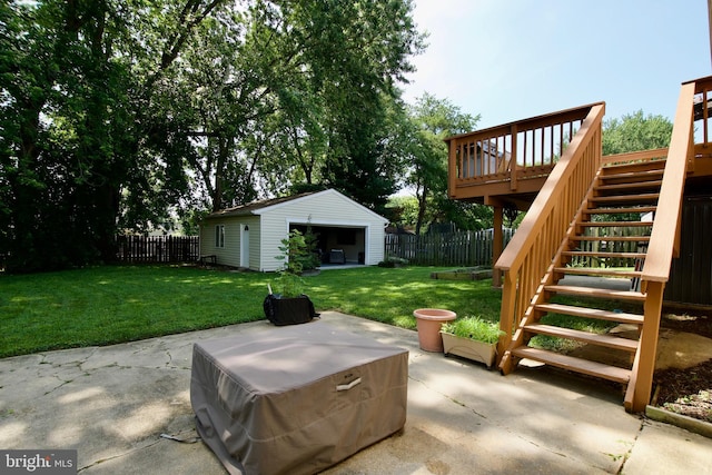 1411 Kentucky Ave, Woodbridge, VA 22191 - fenced backyard featuring a patio, stairs, an outdoor structure, and a wooden deck