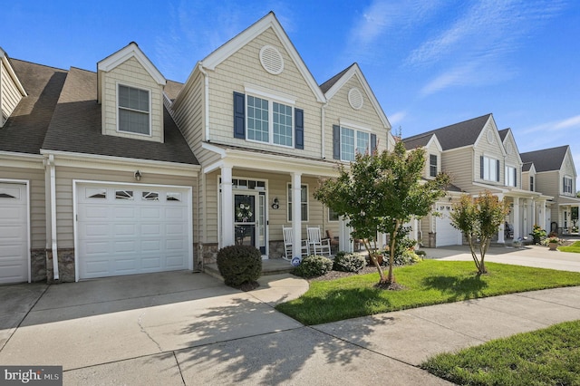 45 Harcrest Ct, Dover, DE 19901 - view of property featuring covered porch, concrete driveway, a garage, stone siding, and a shingled roof