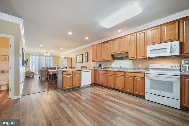 45 Harcrest Ct, Dover, DE 19901 - kitchen with white appliances, ornamental molding, a peninsula, light wood-style floors, and tasteful backsplash