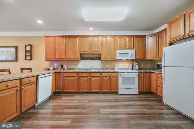 45 Harcrest Ct, Dover, DE 19901 - kitchen with white appliances, ornamental molding, wood finished floors, recessed lighting, and brown cabinetry
