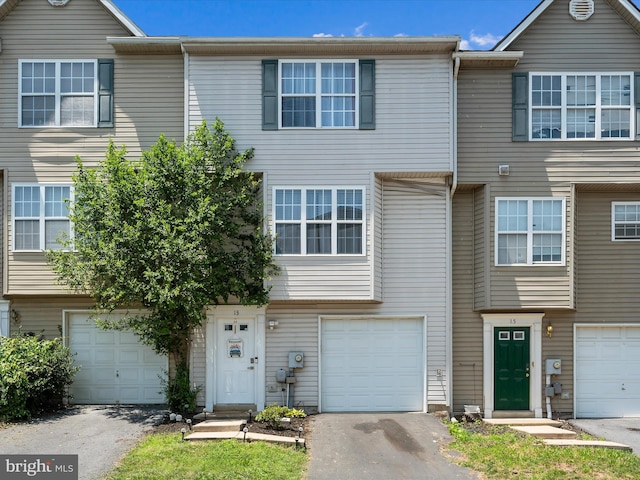 13 Mistala Ct, Inwood, WV 25428 - view of property with an attached garage and driveway