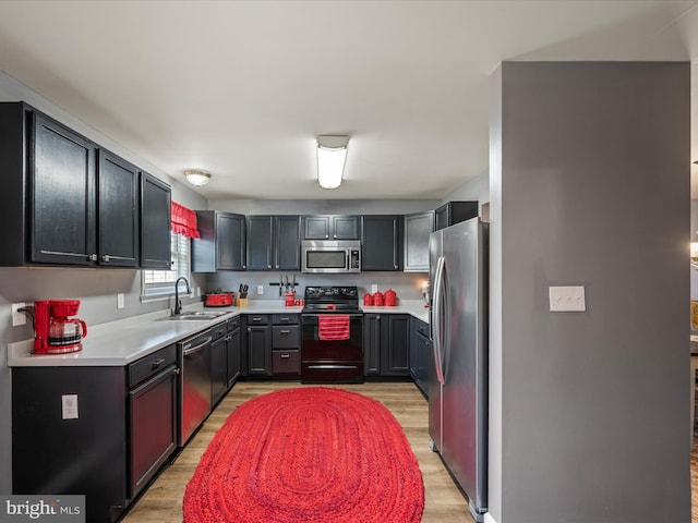 13 Mistala Ct, Inwood, WV 25428 - kitchen featuring appliances with stainless steel finishes, light wood-style floors, and light countertops