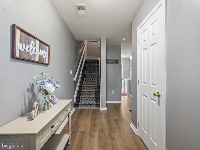 13 Mistala Ct, Inwood, WV 25428 - stairs featuring wood finished floors and baseboards