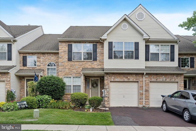 2405 Carriage Ln, Royersford, PA 19468 - view of property featuring stone siding, driveway, a shingled roof, a front yard, and a garage