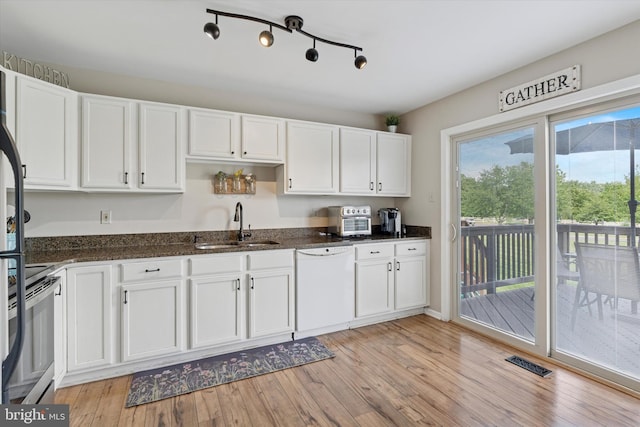 2405 Carriage Ln, Royersford, PA 19468 - kitchen featuring white dishwasher, electric range, white cabinets, light wood finished floors, and dark stone counters